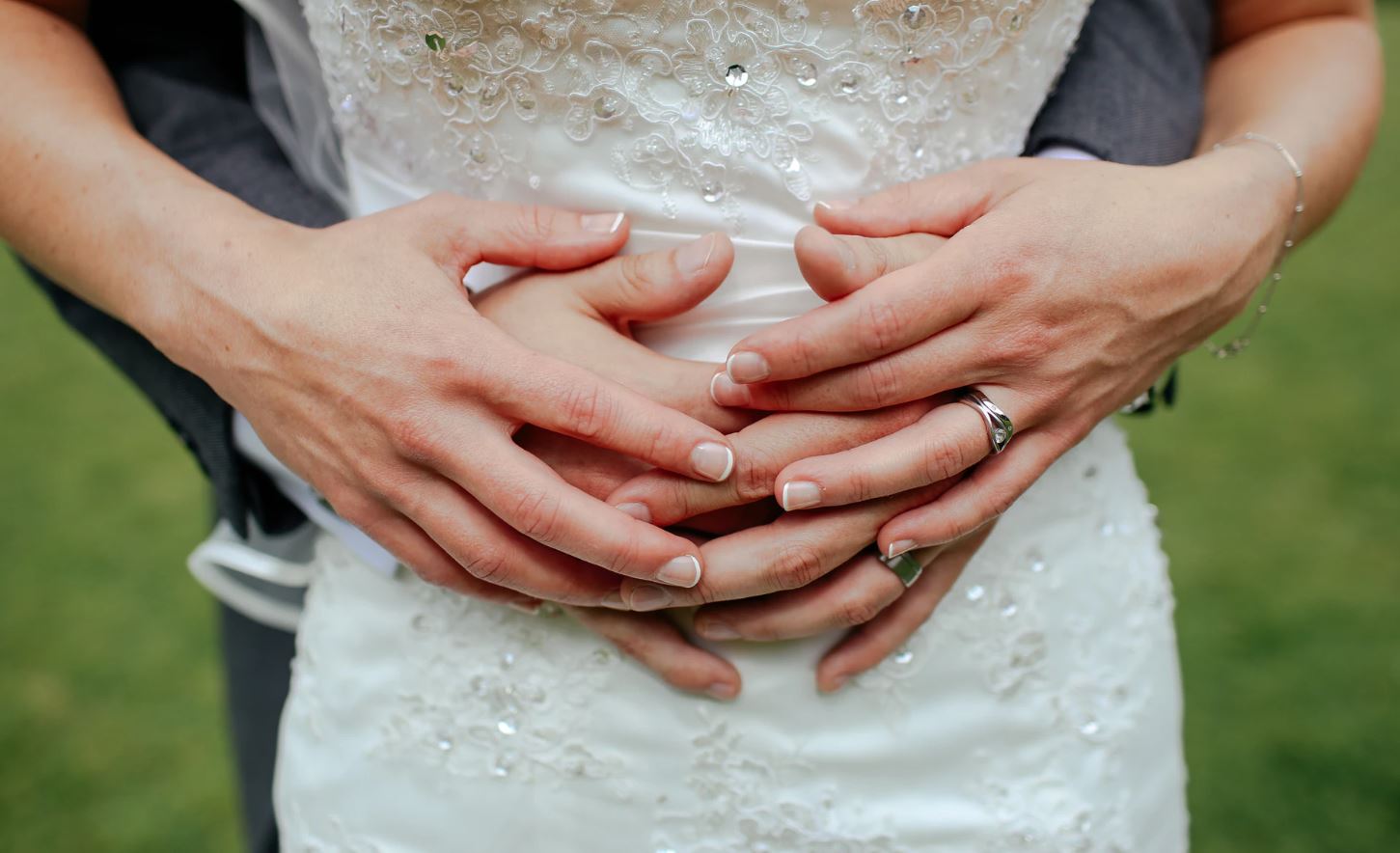 Bride and Groom holding hands