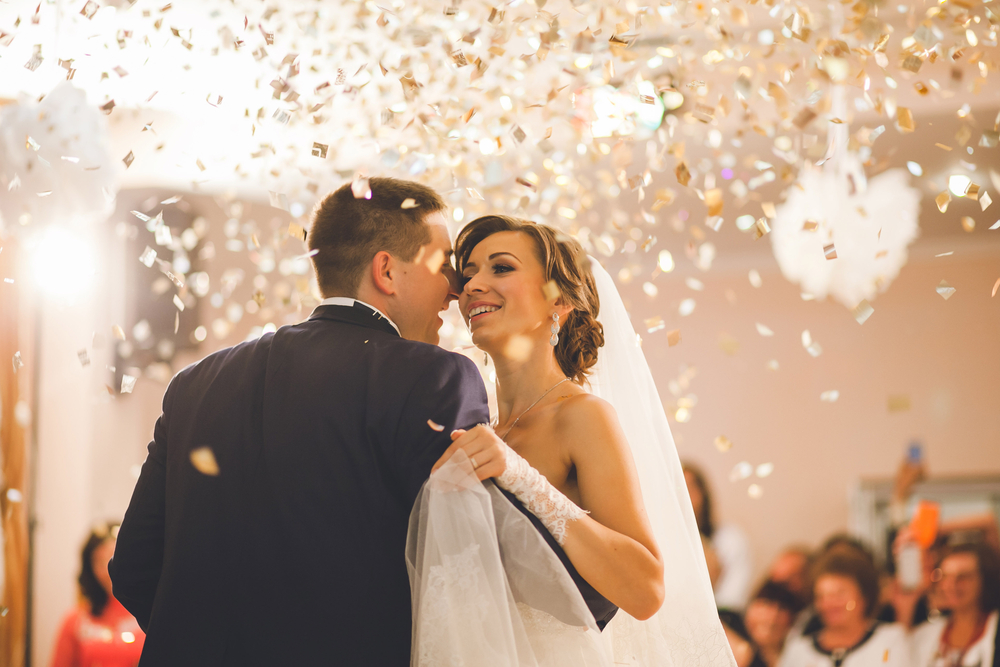 First wedding dance of newlyweds at indoor wedding