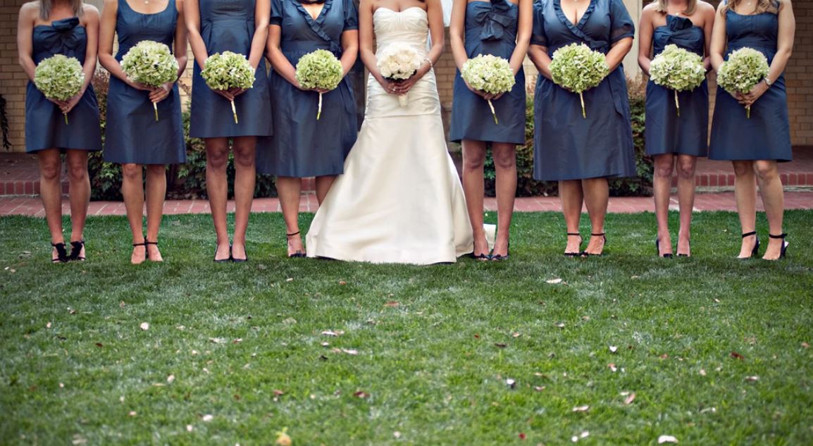 bride and bridesmaids with bouquets