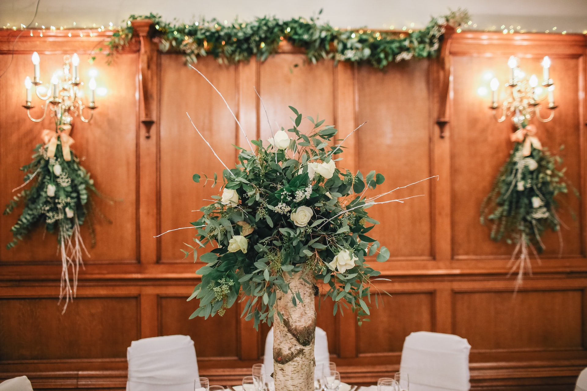 Floral Centerpiece on table in an indoor wedding ceremony