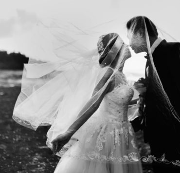 grayscale shot of bride and groom