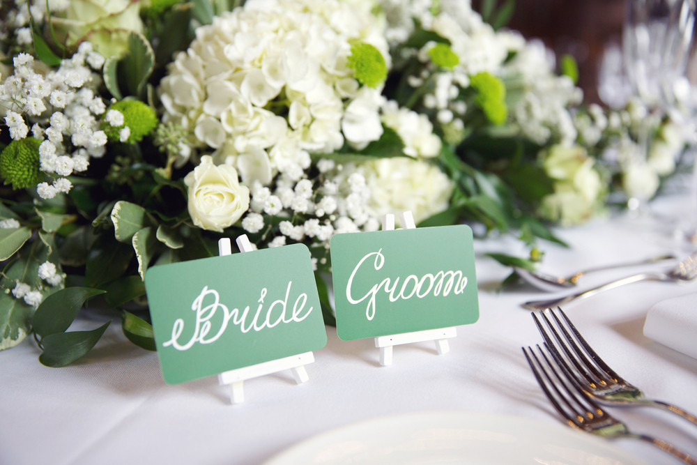place cards for groom and bride on table