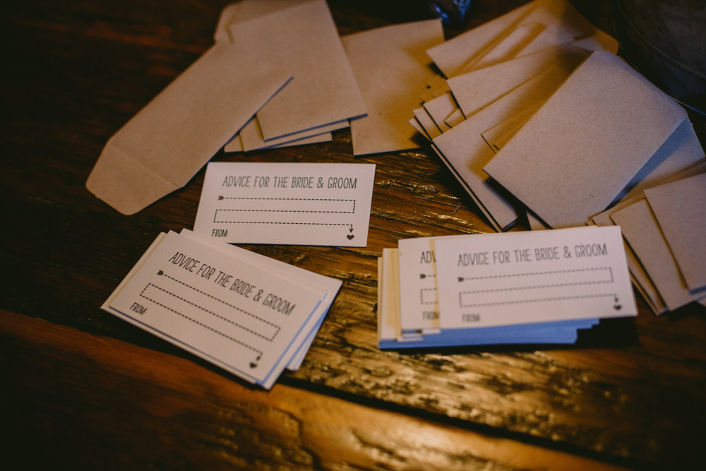 vintage and brown advice cards for groom and bride on wooden table