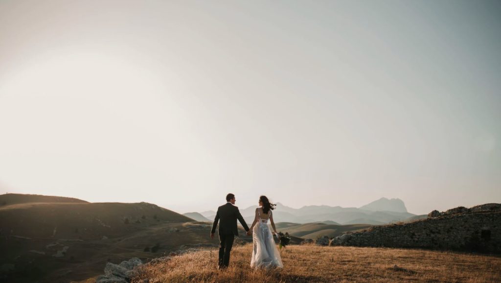 a couple on top of a hill