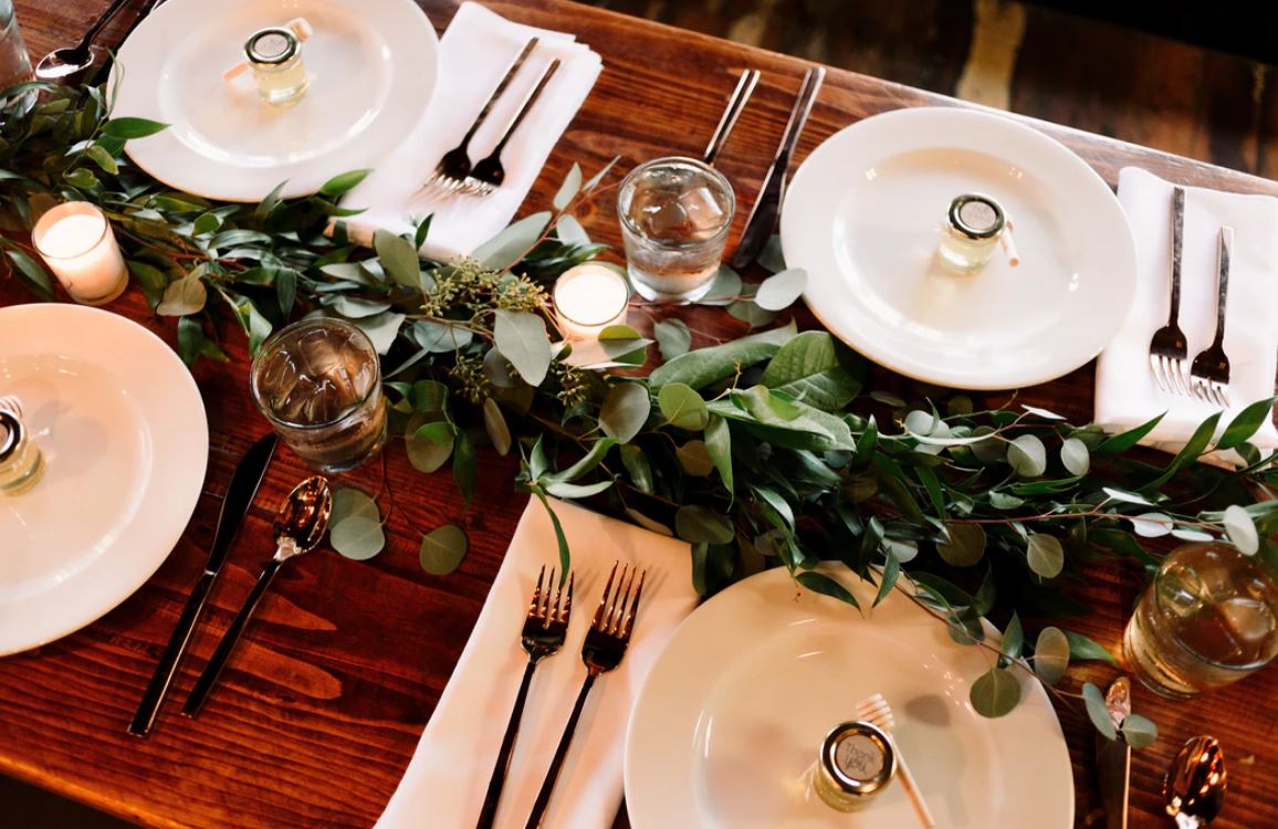 white ceramic dinner plate set on brown wooden table