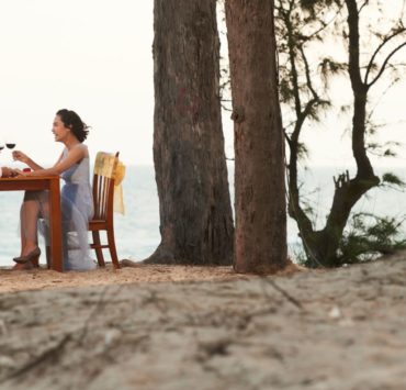 couple clinking glass together