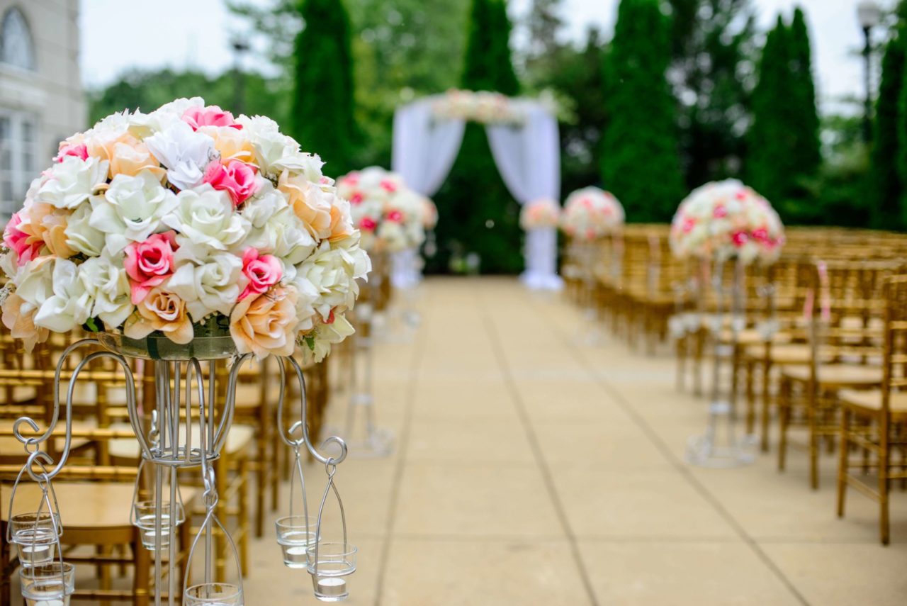 outside wedding venue with floral arrangement