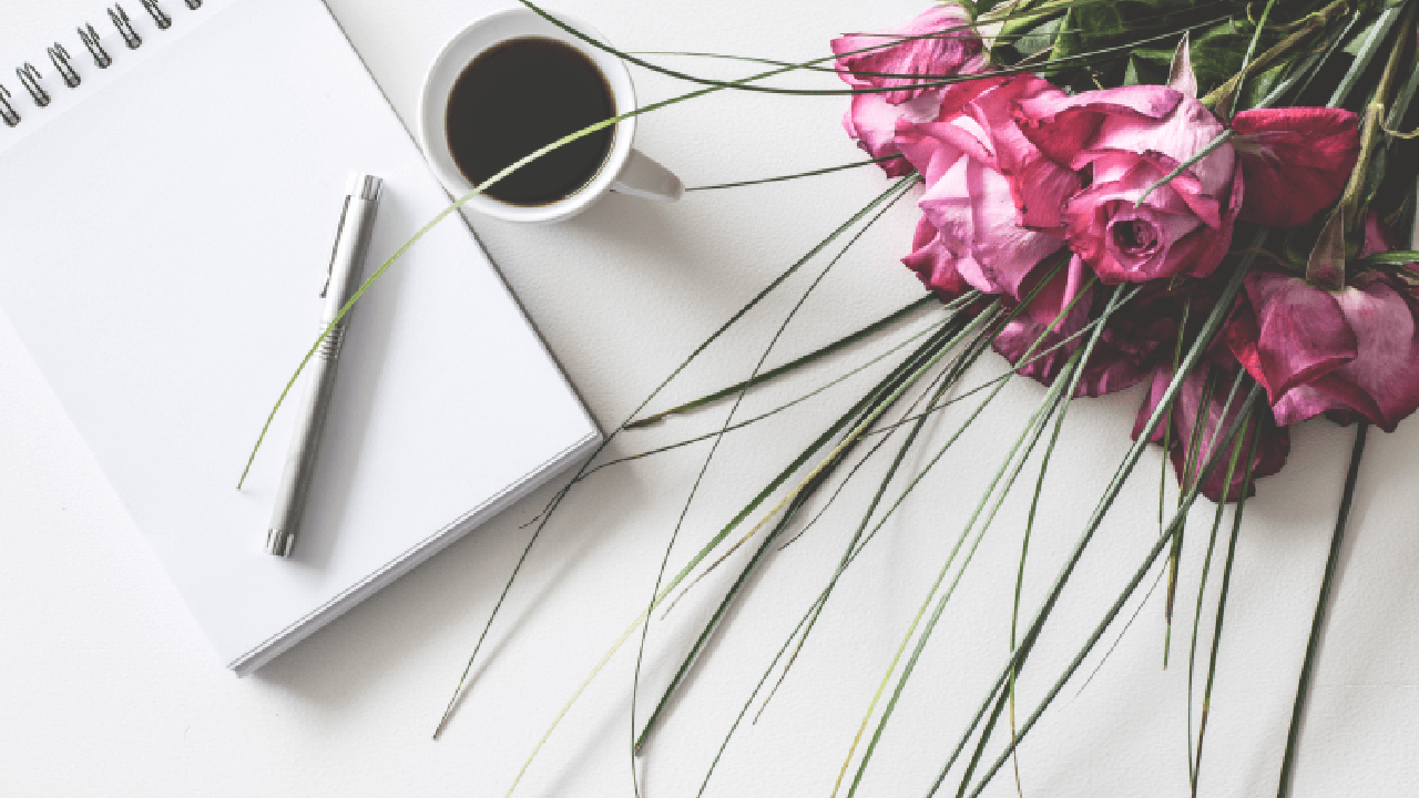 blank notebook with wedding bouquet