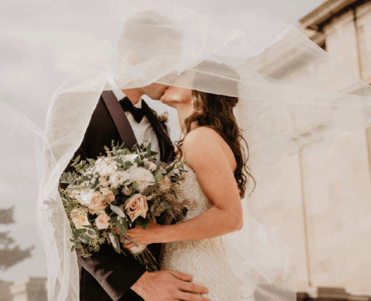 Couple kissing on their wedding