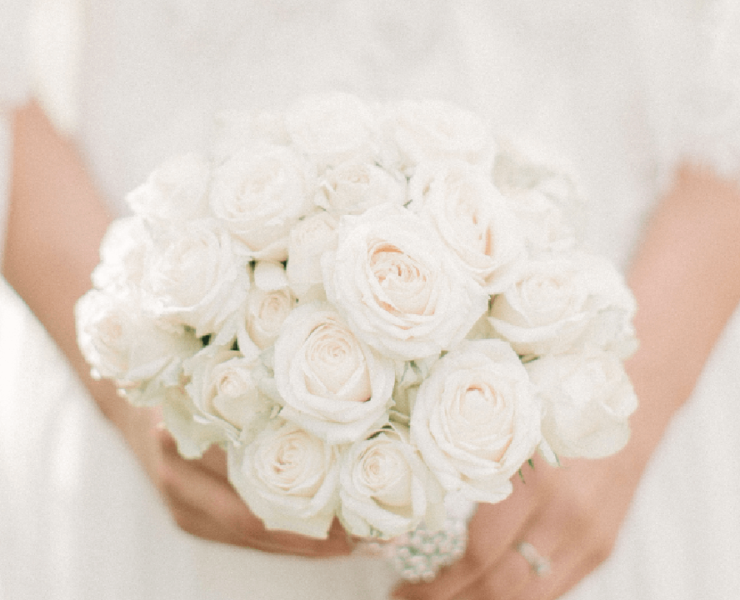 Bride holding a white bouquet