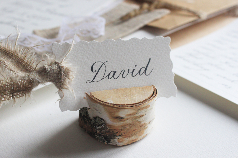 handwritten place card in a rustic wedding reception