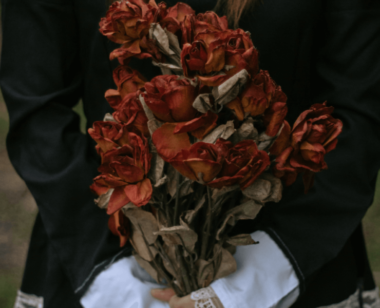 Girl holding dark bouquet