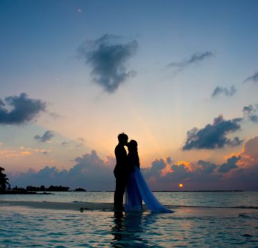 sunset image of a couple on beach