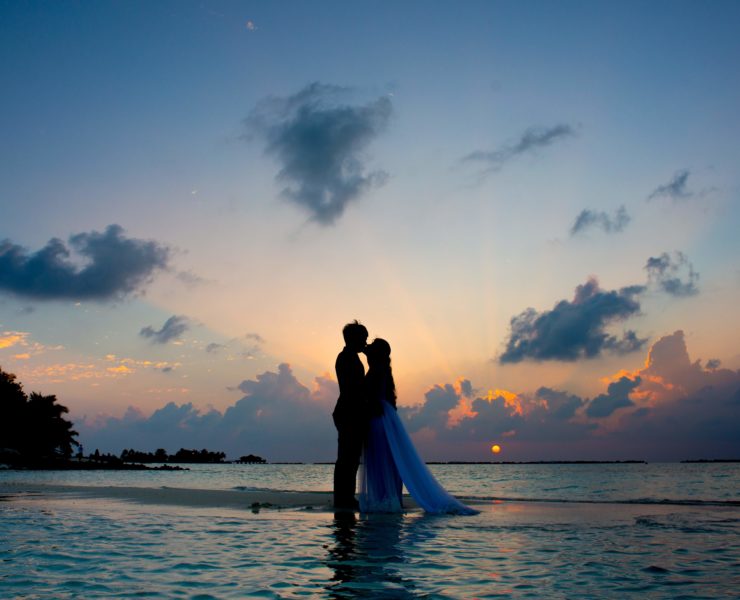 sunset image of a couple on beach