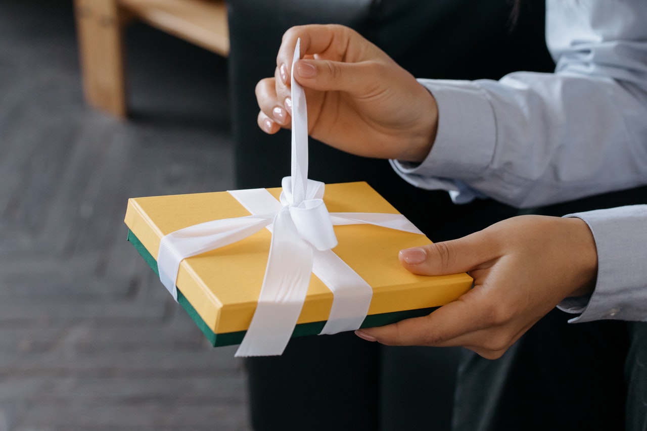 groom opening a wedding present