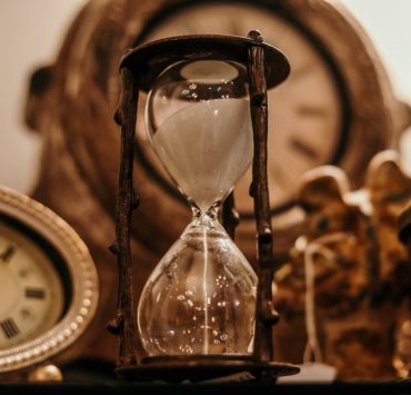 clocks and an hourglass as presents