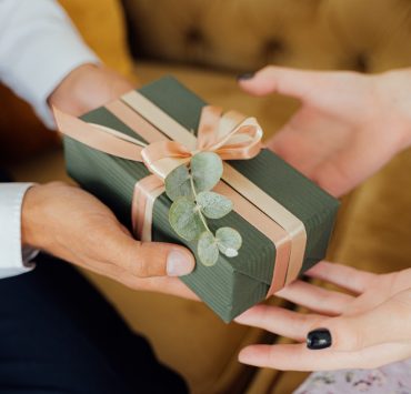 man giving a wedding gift