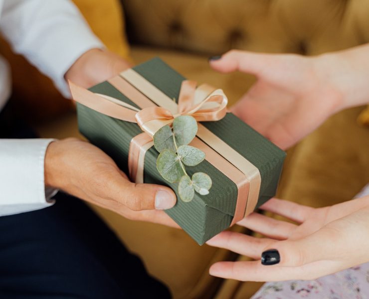 man giving a wedding gift