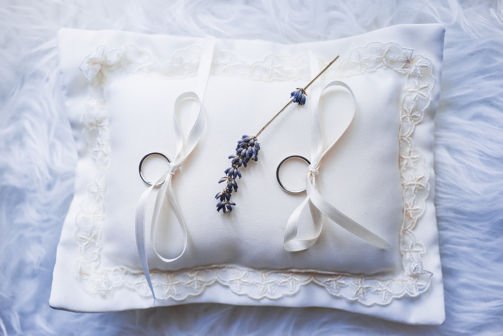 wedding rings tied to a pillow