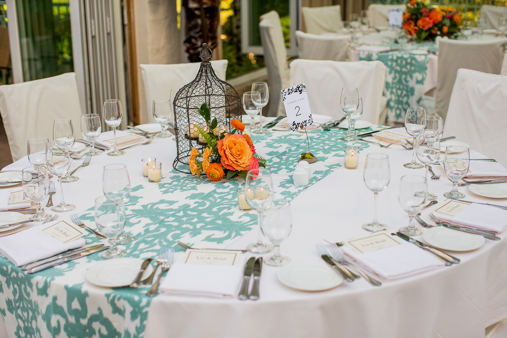 a cage with flowers as a centerpiece