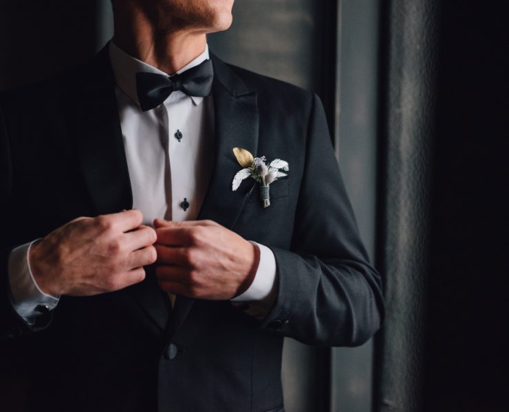 a closeup of a groom's rented tuxedo