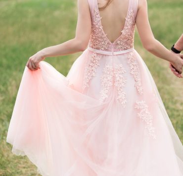a bride in a pink wedding dress