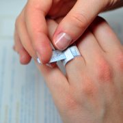 Girl measuring her ring size