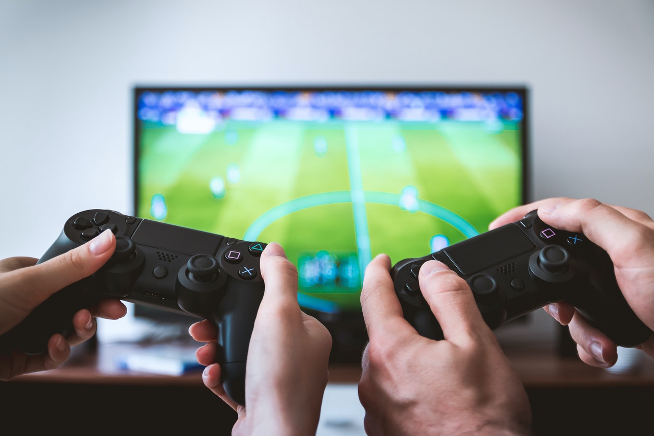 couple holding a game console