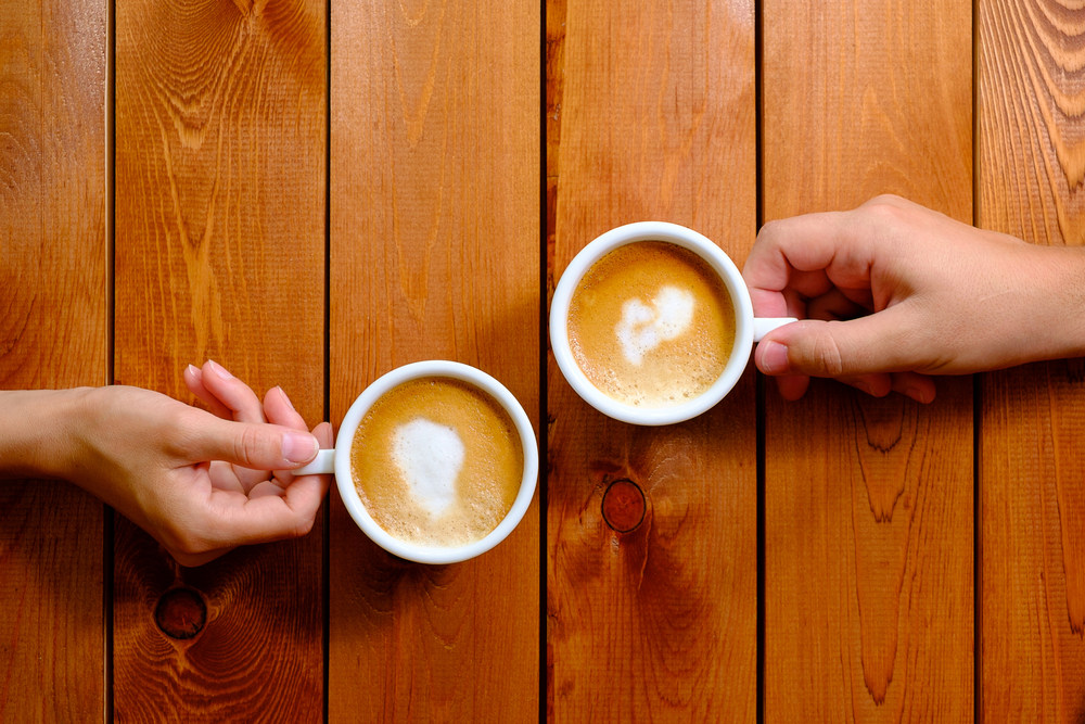 two cups of coffee on table