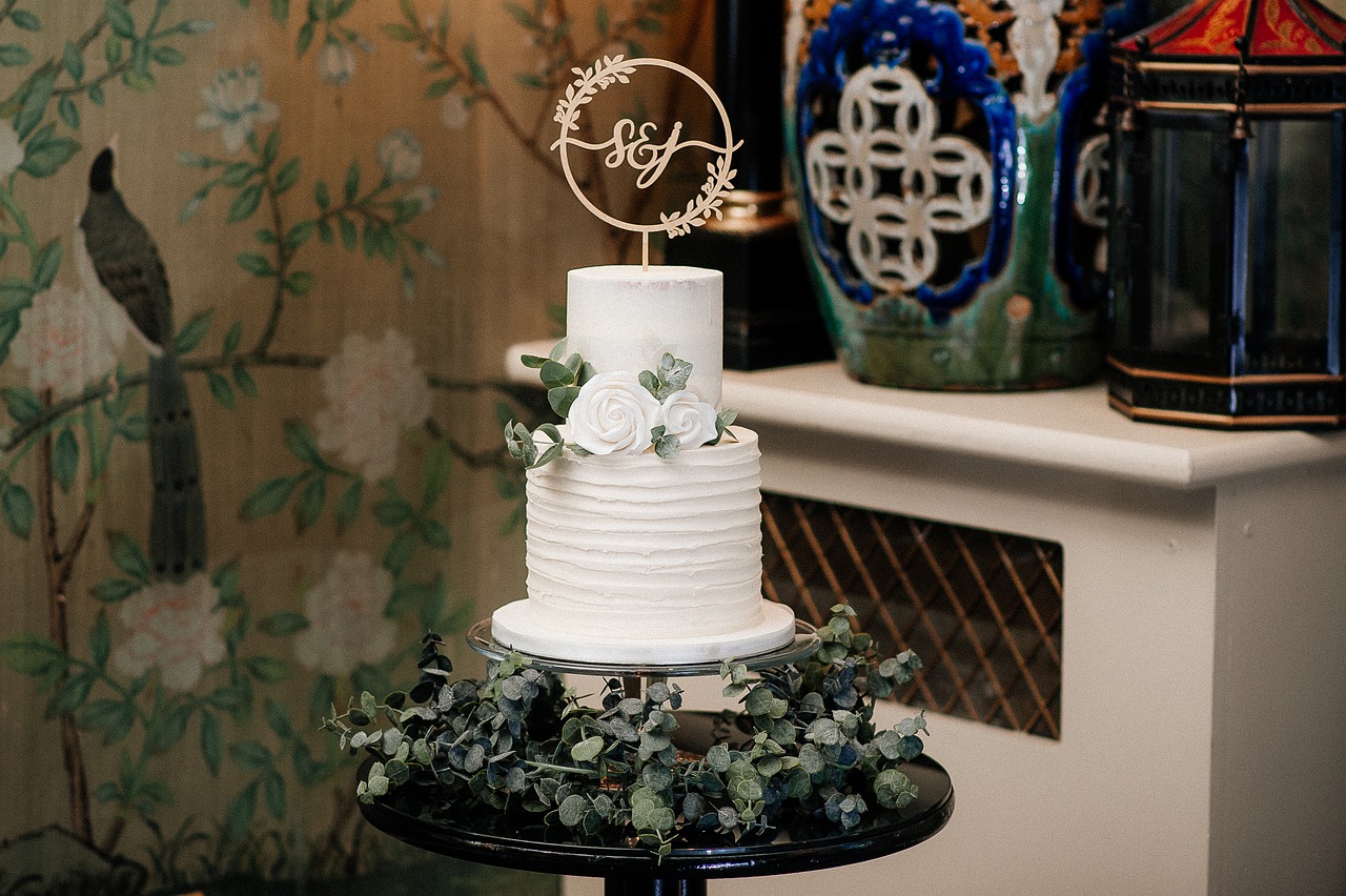 wedding cake with a stencil topper