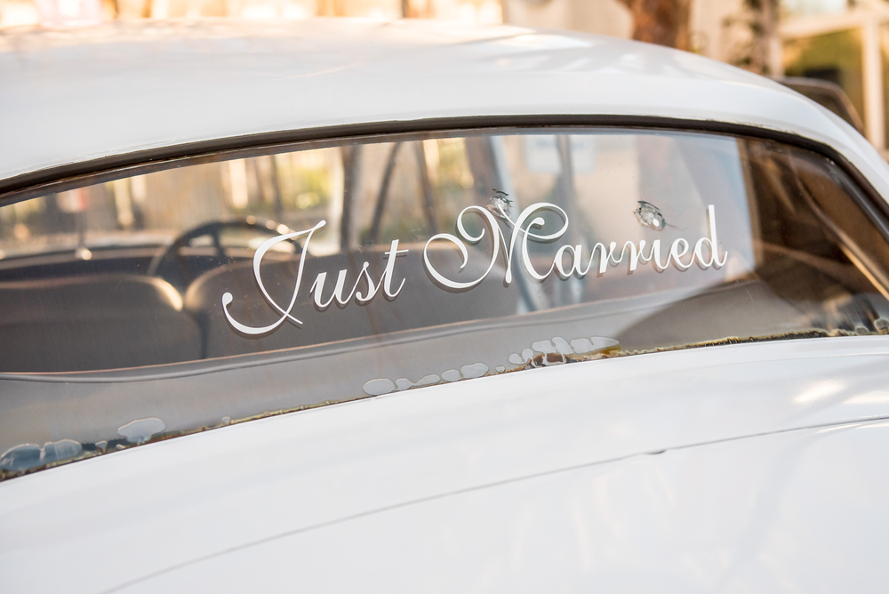 Just Married sticker on the rear car window