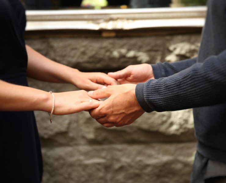 man and woman holding hands