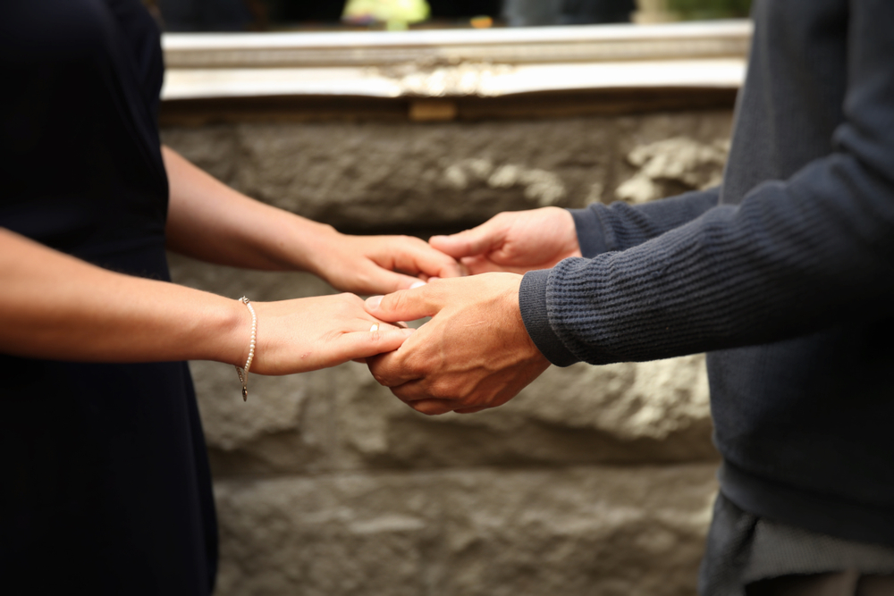 man and woman holding hands