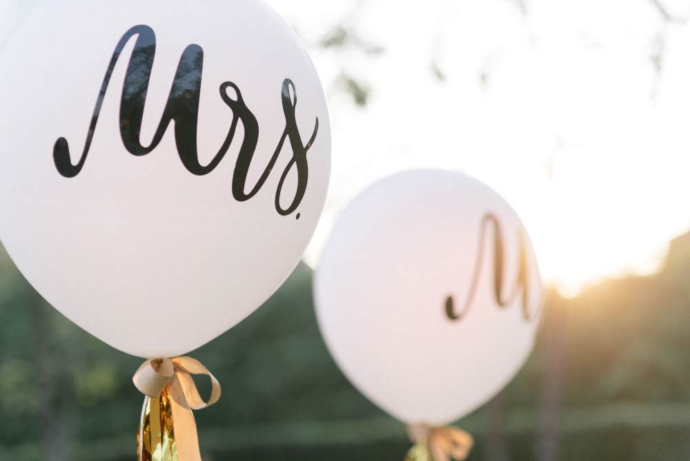 white balloons with text that says Mrs. and Mr.