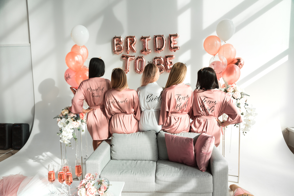 bride having a good time with her bridesmaids at a bachelorette party