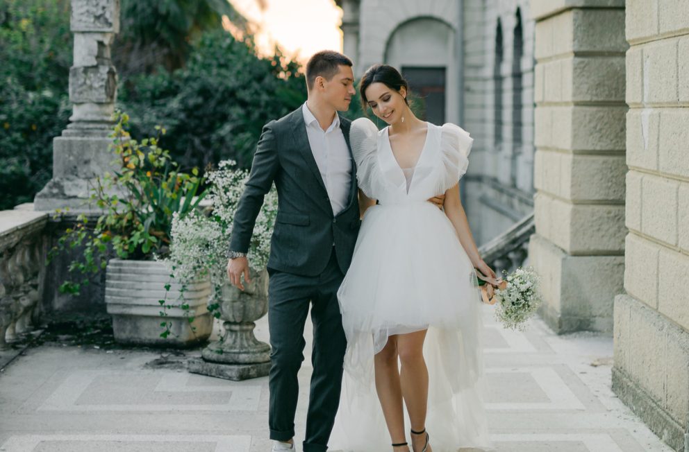 married couple walking outside the wedding venue
