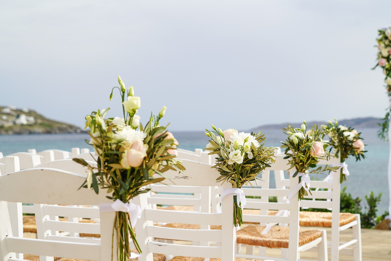 white chairs used for a beach wedding