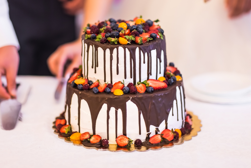 chocolate and vanilla cake with fruits as toppings