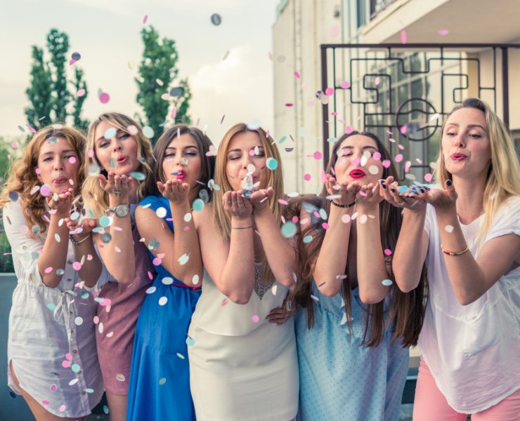 bride and her friends having fun at a bridal shower party