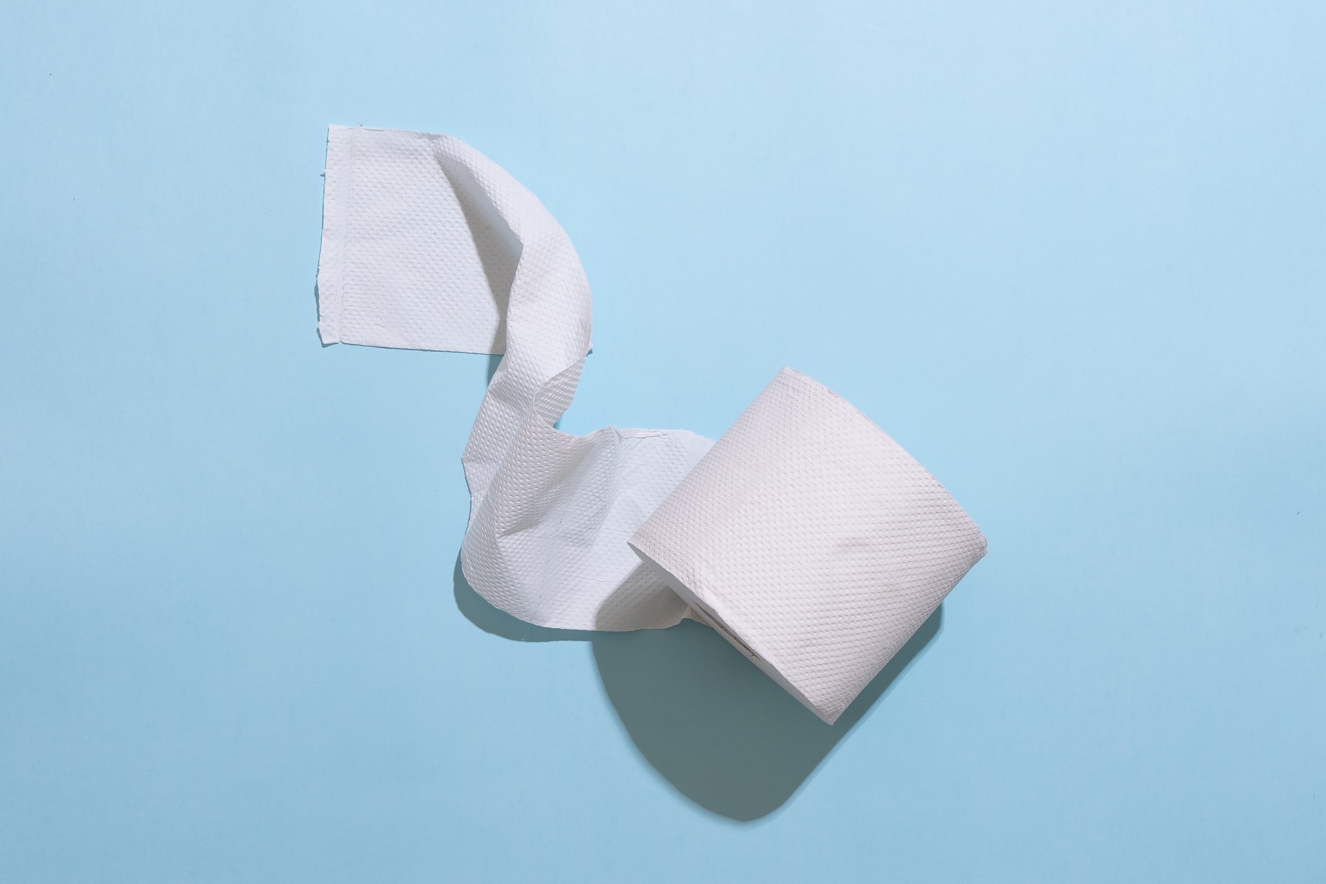 tissue roll on a light blue background