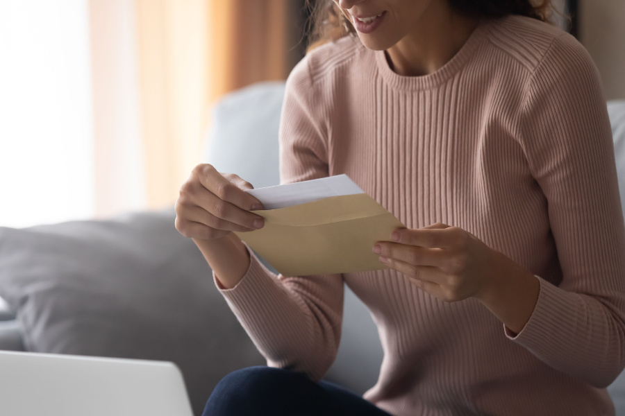 woman holding a tax certificate