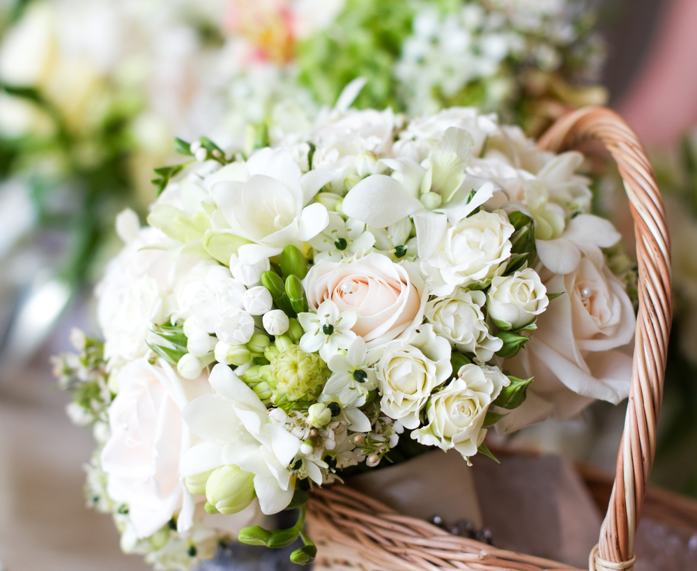 Beautiful white wedding bouquets in basket
