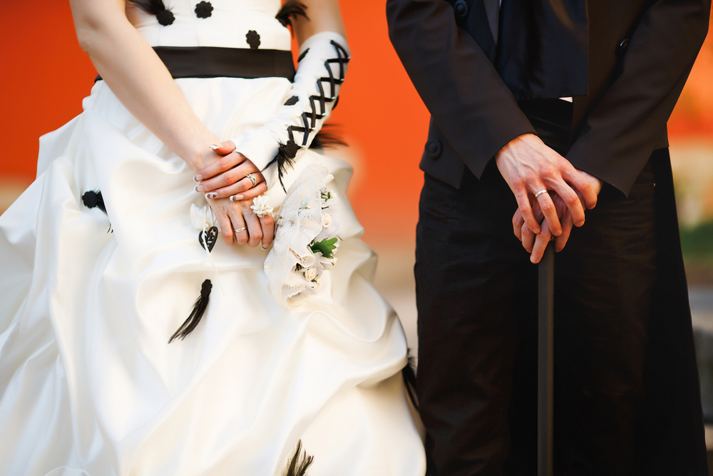 from shoulder to knees picture of bride and groom on gothic themed wedding