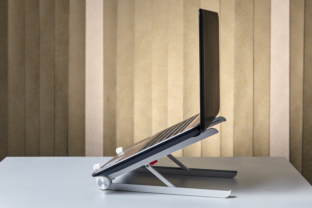 laptop on aluminum and plastic laptop stand