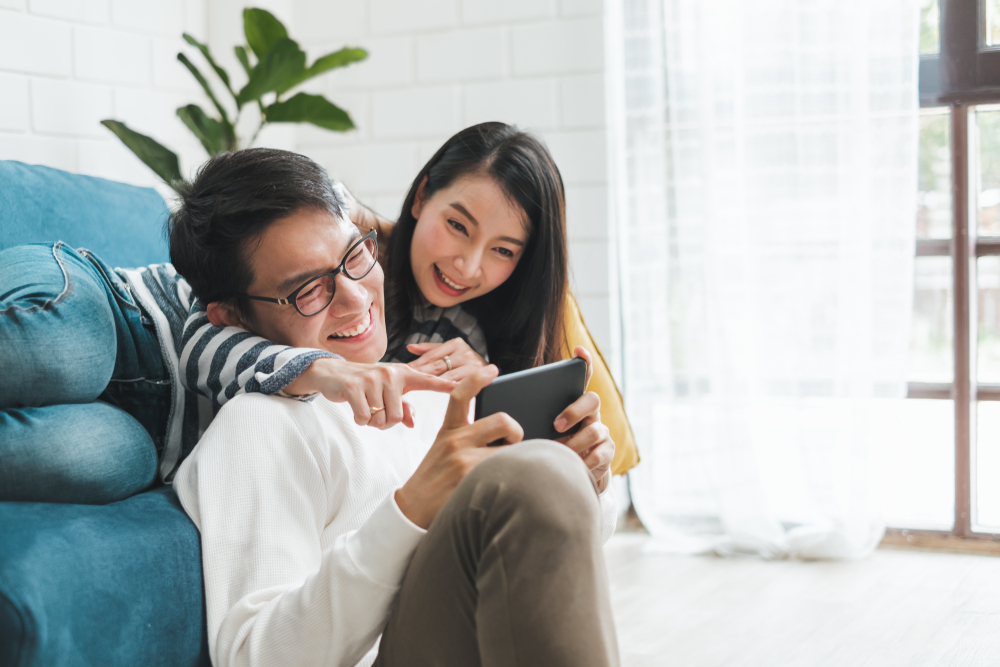 Asian couple man and woman talking and spend time together at home