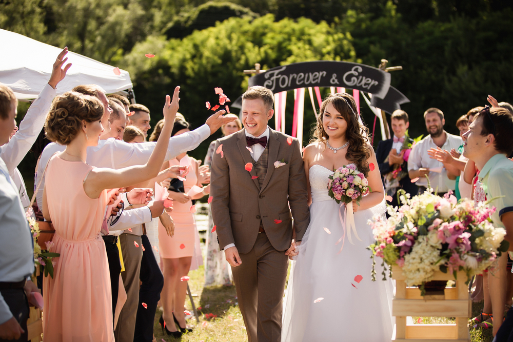 Guests showered the newlyweds with rose petals outdoor