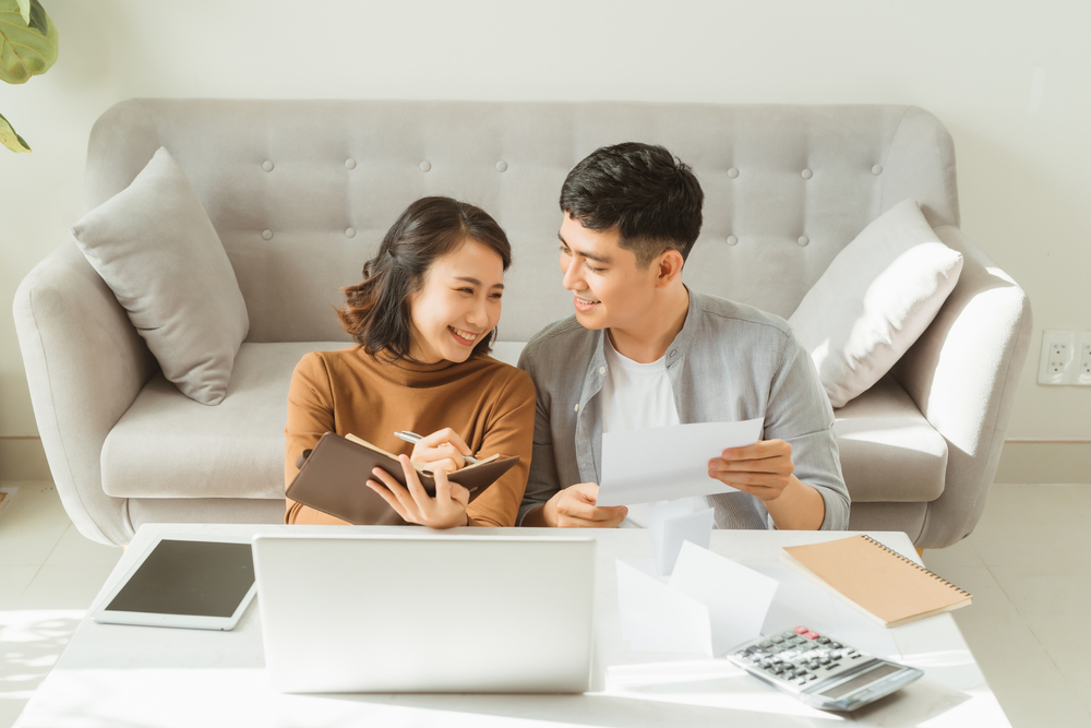 couple discussing and planning together on floor in living room