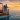 A romantic couple watching sunset over the sea on their second honeymoon