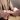 Close up of a man holding a woman's hand and ring during a proposal