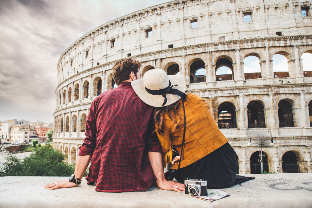 back view of a couple enjoying vacation in Rome